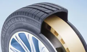 Przekrój opony Michelin z żółtym wzmocnieniem, zapewniającym jazdę typu runflat nawet po przebiciu.